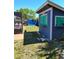 Charming backyard with custom shed, lush lawn, and peaceful pool area at 8588 95Th Ave, Seminole, FL 33777