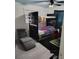 This cozy bedroom features a striking black bunk bed and chair, perfect for or guests at 8588 95Th Ave, Seminole, FL 33777