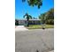 Charming single-story home with a well-manicured lawn and mature trees in a sunny neighborhood at 8588 95Th Ave, Seminole, FL 33777