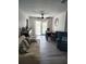 Open-concept living space with a dining area, comfortable seating, and access to the outdoors at 8588 95Th Ave, Seminole, FL 33777