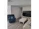 Bright living room featuring modern flooring, comfortable seating, and a large television at 8588 95Th Ave, Seminole, FL 33777