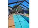 Refreshing outdoor pool with screened enclosure, perfect for relaxing and entertaining at 8588 95Th Ave, Seminole, FL 33777