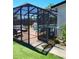 Outdoor pool area with screened enclosure and shaded seating at 8588 95Th Ave, Seminole, FL 33777