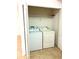 Hall closet with a washer and dryer at 9056 Iron Oak Ave, Tampa, FL 33647