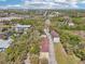An aerial perspective of a real estate complex with mature trees and expansive area at 958 Sombra St, Tampa, FL 33619