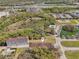 Community aerial view featuring a pond, pool, and development land at 958 Sombra St, Tampa, FL 33619