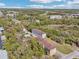 Aerial view showing community near highway with a parking lot and pond at 958 Sombra St, Tampa, FL 33619