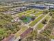 Aerial view of a community with a pond, pool, and lots ready for development at 958 Sombra St, Tampa, FL 33619
