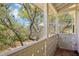 Balcony with views of lush greenery, offering a peaceful retreat at 958 Sombra St, Tampa, FL 33619
