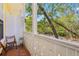 Balcony with brick tiles and views of the surrounding trees, perfect for relaxing outdoors at 958 Sombra St, Tampa, FL 33619