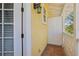 Exterior view of covered balcony with terracotta tile and white decorative door at 958 Sombra St, Tampa, FL 33619