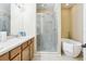 Elegant bathroom showcasing a glass-enclosed shower and a luxurious soaking tub for relaxation at 958 Sombra St, Tampa, FL 33619