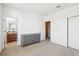 Neutral bedroom with a dresser and access to an ensuite bathroom, offering a tranquil retreat at 958 Sombra St, Tampa, FL 33619