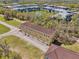 Aerial view of a multi-story building with garages in a green neighborhood at 958 Sombra St, Tampa, FL 33619