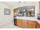Open kitchen bar overlooking living area, showcasing modern design and connectivity at 958 Sombra St, Tampa, FL 33619