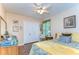 Inviting bedroom with hardwood floors, soft lighting, ample closet space, and a comfortable queen bed at 10222 Woodford Bridge St, Tampa, FL 33626