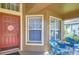 Inviting front porch with blue wicker chairs and decorative accents at 10222 Woodford Bridge St, Tampa, FL 33626