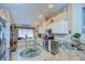 Bright kitchen with white cabinetry, stainless steel appliances, and a cozy window seat for added charm at 10222 Woodford Bridge St, Tampa, FL 33626