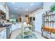 Spacious kitchen featuring white cabinets, stainless steel appliances, and stylish island, ideal for cooking and entertaining at 10222 Woodford Bridge St, Tampa, FL 33626