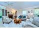 Inviting living room with neutral tones, fireplace, comfortable seating, and natural light at 10222 Woodford Bridge St, Tampa, FL 33626