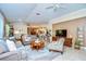 Cozy living room with neutral tones, comfortable seating, and an open floor plan with tile flooring at 10222 Woodford Bridge St, Tampa, FL 33626