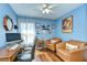 Well-lit office space with hardwood floors, comfortable leather seating, and built-in shelving and storage at 10222 Woodford Bridge St, Tampa, FL 33626