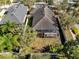 Aerial view of home with a screened lanai and fenced backyard at 11202 Wembley Landing Dr, Lithia, FL 33547