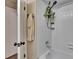 Bathroom featuring a shower with white tiles and shelving at 11308 Grandville Dr, Temple Terrace, FL 33617