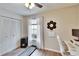 Bright room with a fan, closet, and computer setup at 11308 Grandville Dr, Temple Terrace, FL 33617