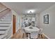 Cozy dining area with modern lighting and easy access to kitchen at 11308 Grandville Dr, Temple Terrace, FL 33617