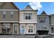 Charming townhome featuring a blue door and neutral stucco exterior at 11308 Grandville Dr, Temple Terrace, FL 33617