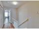 Hallway leading to the bedroom showcases flooring and natural lighting at 11308 Grandville Dr, Temple Terrace, FL 33617