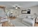 Bright and airy living room featuring hardwood floors and neutral decor at 11308 Grandville Dr, Temple Terrace, FL 33617