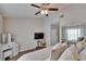 Bright main bedroom featuring a closet, ceiling fan, and vanity at 11308 Grandville Dr, Temple Terrace, FL 33617
