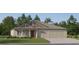 Charming single-story home featuring a two-car garage and a well-manicured lawn at 11861 Blue Diamond Trl, Parrish, FL 34219