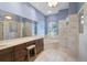 Elegant bathroom with double vanity, large soaking tub, and natural light at 12 Medalist Ter, Rotonda West, FL 33947