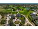 Aerial view of the golf course and the associated clubhouse in a residential community at 12 Medalist Ter, Rotonda West, FL 33947