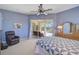Spacious main bedroom with pool views, a ceiling fan, and comfortable seating area at 12 Medalist Ter, Rotonda West, FL 33947