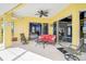 Covered patio with comfortable seating and seamless indoor-outdoor flow at 12 Medalist Ter, Rotonda West, FL 33947