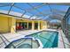 Backyard pool with screened enclosure and attached jacuzzi at 12 Medalist Ter, Rotonda West, FL 33947