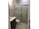 Bathroom featuring a sink vanity, large shower with glass door, and contemporary finishes at 1214 Godavari Way, Wesley Chapel, FL 33543