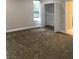 Spacious bedroom with plush carpeting, closet, and a bright window at 1214 Godavari Way, Wesley Chapel, FL 33543
