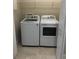Practical laundry room with modern washer and dryer, offering convenience for household chores at 1214 Godavari Way, Wesley Chapel, FL 33543