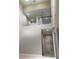 A bright living area featuring high ceilings, modern lighting, and neutral wall colors at 1214 Godavari Way, Wesley Chapel, FL 33543