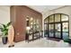 Beautifully designed lobby with decorative mirrors and modern chandelier at 1214 Godavari Way, Wesley Chapel, FL 33543