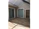 A covered patio features sliding glass doors leading inside the home at 1214 Godavari Way, Wesley Chapel, FL 33543