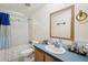 Bathroom with tub and shower, toilet, vanity, sink and mirror at 12519 Cambridge Ave, Tampa, FL 33624