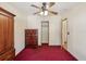 Bedroom featuring neutral walls, ceiling fan, carpeting, and closet at 12519 Cambridge Ave, Tampa, FL 33624