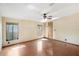 Bedroom with wood-look floors and natural light from two windows at 12519 Cambridge Ave, Tampa, FL 33624