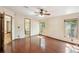 Bedroom with wood-look floors and en-suite bathroom with bathtub at 12519 Cambridge Ave, Tampa, FL 33624